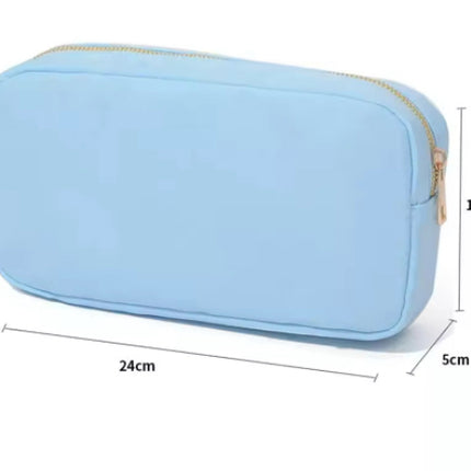 The Lindsay nylon makeup bag — shown open with compartments