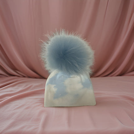 Personalized cotton hat with fur pom — shown on baby