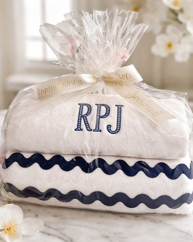 Personalized luxury towel gift set — shown folded and tied with ribbon, embroidery included