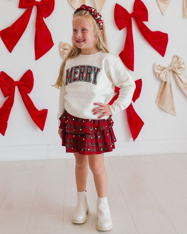 Merry Tartan Patch Christmas Sweatshirt styled with skirt