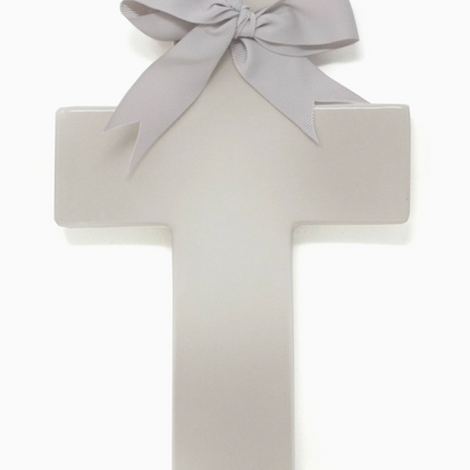 Personalized ceramic ombre cross — styled on shelf with baby items