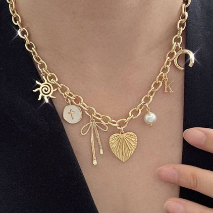 SUN BOW PEARL CROSS DISC  CHARM NECKLACE