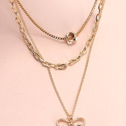 MULTI LAYER PEARL BOW CAHRM NECKLACE