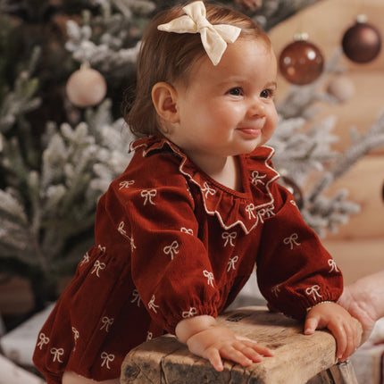Freya Romper Bows - baby bubble romper in rust corduroy with cream bow embroidery and ruffled collar