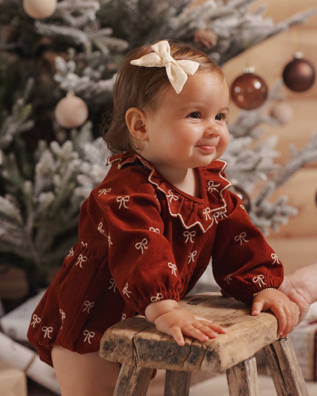 Freya Romper Bows - baby bubble romper in rust corduroy with cream bow embroidery and ruffled collar