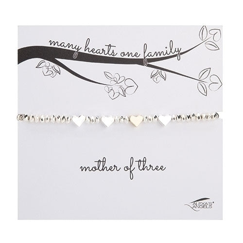 Mother of bracelet — shown with four charms, close up detail