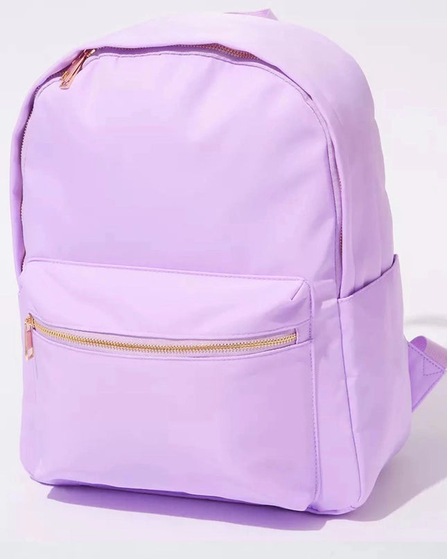 The Jules nylon backpack — shown from back angle