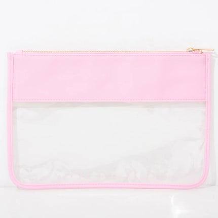 The Allie clear pouch — shown open with contents