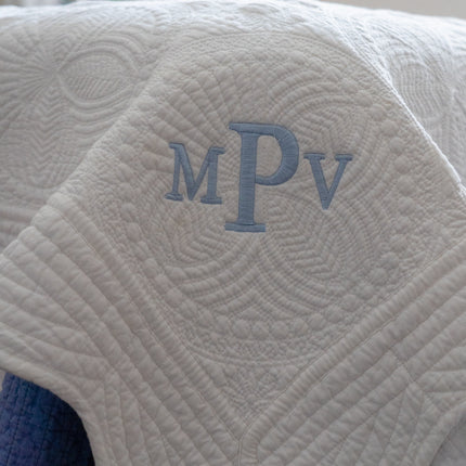 Personalized baby quilt — shown folded, ready to gift