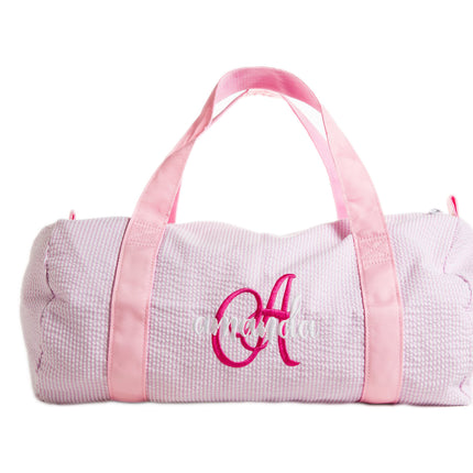 Oh Mint personalized children's duffel — shown open with contents