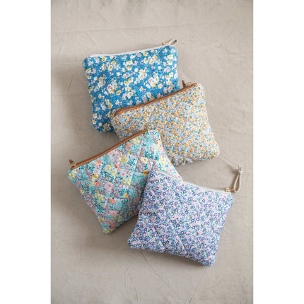 Quilted floral chintz zip pouch — shown open with contents