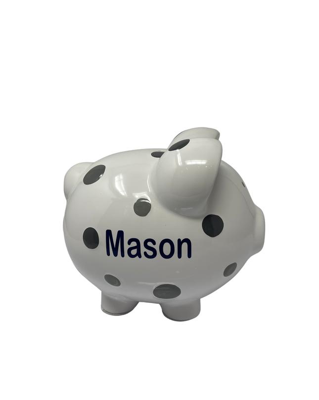 Personalized polka dot piggy bank — shown with coins being dropped in